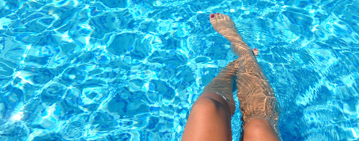Person Legs In Swimming Pool Image